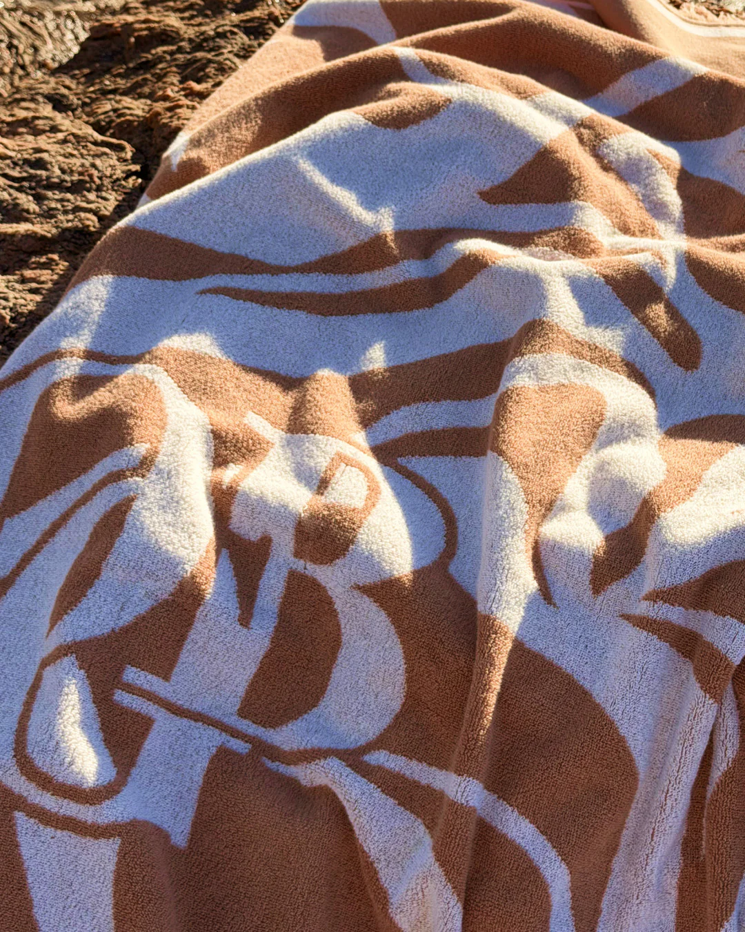 Olcay Gulsen Swirl Beach Towel