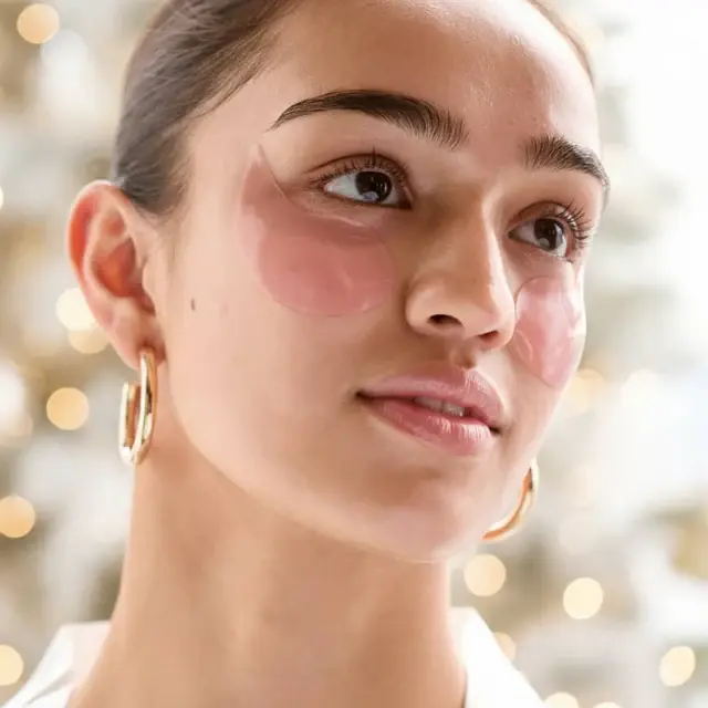 woman-wearing-rose-eye-gels-holiday-in-use-patches_1 Patchology Patching All The Way Under Eye Patches Gift Set